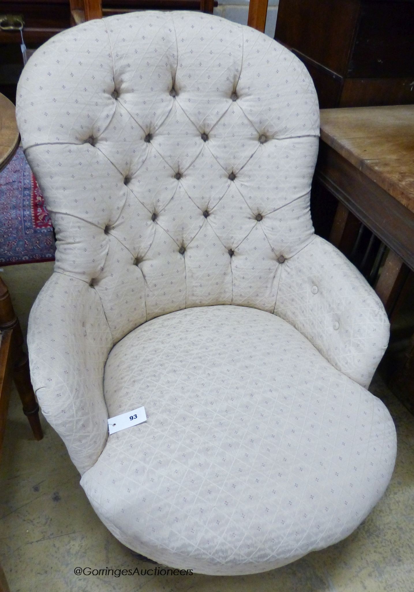 A Victorian upholstered spoon back armchair